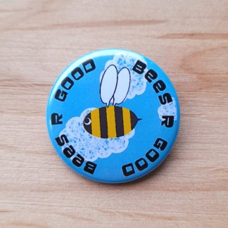Pin badges and magnets featuring a cartoon bee and the words "Bees R Good"