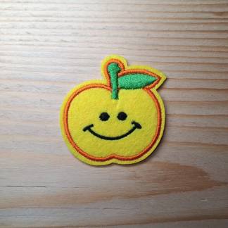 Iron-on patch featuring a yellow smiling apple