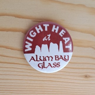 Pin badge advertising a glassblowing business on the Isle of Wight