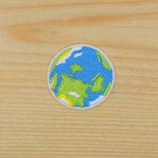 This product is a circular, embroidered Planet Earth iron-on patch