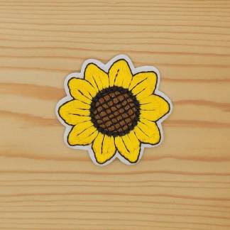 A yellow sunflower embroidered iron-on patch